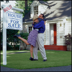 couple-with-sold-sign